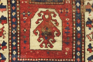 One of the most archaic and powerful little kazak or Karrabaugh prayer rug I have had. Right up there in rough condition as well. Very coarse weave. All good colors. Recently washed.  ...