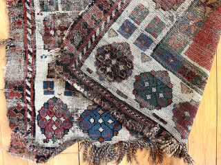 Early Caucasian rug with some usual and some unusual design features. Talish group long narrow format with iconic endless knot and “dice” elements. The additional quirky field decoration makes this a unique  ...