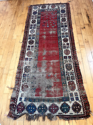 Early Caucasian rug with some usual and some unusual design features. Talish group long narrow format with iconic endless knot and “dice” elements. The additional quirky field decoration makes this a unique  ...