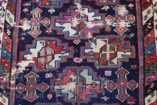 antique tribal mystery long rug. Interesting older rug with wonderful graphics and beautiful colors. Unfortunately, in very poor, abused condition. Excellent quality wool and all natural colors. Washed but not repaired. Northwest  ...