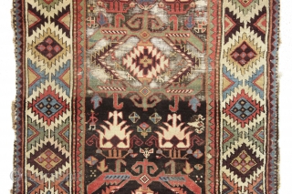 antique tribal long rug, probably nw persian. Interesting design featuring a very attractive bold border. "as found", very dirty with areas of heavy brown oxidation, wear, edge damage, a few stains, old  ...