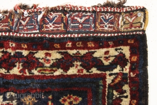 antique persian bagface. "as found", mostly good thick pile, some wear and edge damage as shown. Fancy closure tabs with cotton highlights. Dark and mysterious. Maybe Luri or Baktiari? 19th c. 26"  ...