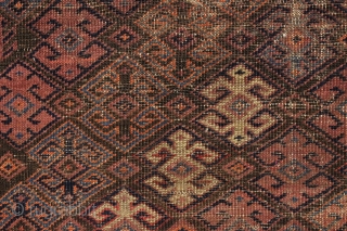 antique baluch rug with an interesting archaic waisted diamond lattice design. Colorful ivory ground turkman line border. As found, very very dirty with scattered old damage and wear as shown. Interesting study  ...
