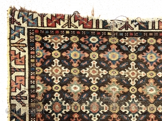 Antique rug fragment, possibly northwest Persian, with an interesting design featuring all over cloud band type motifs. Good natural colors. Good age, ca. 1880 or earlier. 32” x 39”    