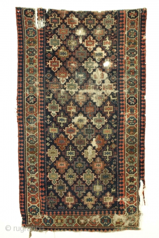 Old tribal mystery rug fragment. Northwest Persian? I don't know what it is but I like it. All good natural colors including a fine grape purple. Very dirty and damaged as shown.  ...