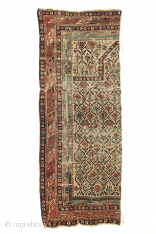 Antique caucasian shirvan prayer rug fragment. Almost half the rug. All good natural colors. Old piece with great variety of plant designs in the lattice. Very very dirty. All manner of damage  ...