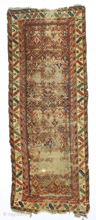 early caucasian kuba long rug. Superb color and unusually varied and delicate drawing. I don't think I've ever seen this much variety of elements in a similiar rug. Heavily oxidized brown ground  ...