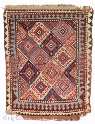 antique little mystery weaving. Looks like a kurdish piece but the weave, palette and tall format all indicate something else. Caucasian? All natural colors. Turkish knotted. Sides are original with weft returns.  ...