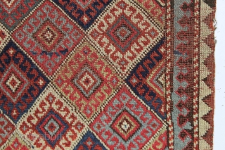 antique little mystery weaving. Looks like a kurdish piece but the weave, palette and tall format all indicate something else. Caucasian? All natural colors. Turkish knotted. Sides are original with weft returns.  ...