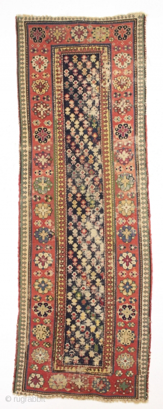 Antique caucasian rug. Early example in abused condition. An interesting design with all natural colors (no fuchsine). Grandma worked overtime flat stitching this beauty, filling in substantial sections by candlelight no doubt.  ...