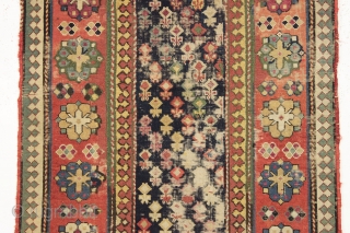 Antique caucasian rug. Early example in abused condition. An interesting design with all natural colors (no fuchsine). Grandma worked overtime flat stitching this beauty, filling in substantial sections by candlelight no doubt.  ...