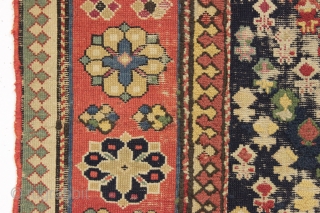 Antique caucasian rug. Early example in abused condition. An interesting design with all natural colors (no fuchsine). Grandma worked overtime flat stitching this beauty, filling in substantial sections by candlelight no doubt.  ...