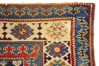 Early caucasian rug. Boteh or boats with oars? Unusually dynamic drawing both in field and borders. I have never seen a field drawn like this. All natural colors including a splendid old  ...