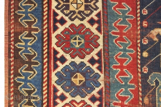 Early caucasian rug. Boteh or boats with oars? Unusually dynamic drawing both in field and borders. I have never seen a field drawn like this. All natural colors including a splendid old  ...