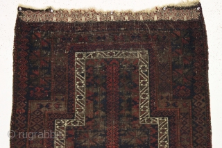 Early little timuri baluch prayer rug. Interesting archaic tree motif. All natural colors. "As found", dirty and thin with heavy black oxidation. Remnant original fancy selvages and kelim ends. 3rd qtr. 19th  ...