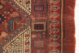 early nw persian rug with eye catching drawing and beautiful old colors. Multiple reds, light blues and a fine old purple. Complete but very much abused with areas of heavy wear and  ...