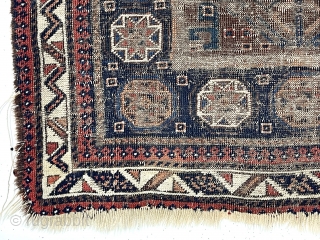 Ghostly but friendly old Baluch square middle bagface. I like the border. 19th c. 
2’7” x 2’10”                