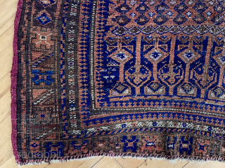 Antique little Baluch rug with an unusual, perhaps unique design. Has wear and small damages. Time to empty the cedar chests. 19th c. 3’7” x 5’5”       