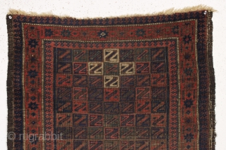 antique baluch rug. Something of an unusual design with all those z's. All good colors with some camel wool pile. "as found", very dirty with wear and old patch as shown and  ...