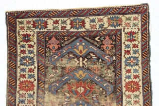 antique little east caucasian rug, probably best described as seichour, with an unusual variation of the bijov design. The light blue wing like medallions are hard to ignore. "as found", very dirty  ...