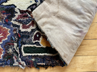 Early small American hooked rug. Original attractive design. Thick heavy construction, fabric backed. As found locally, some edge unraveling and wear. 19th c. 
20” x 36”  waynecbarron@aol.com     