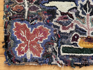 Early small American hooked rug. Original attractive design. Thick heavy construction, fabric backed. As found locally, some edge unraveling and wear. 19th c. 
20” x 36”  waynecbarron@aol.com     