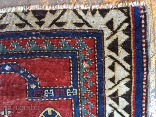 Early very small Kazak prayer rug. spacious drawing and rich saturated natural colors. As found, dirty with wear, holes, old moth damage, end loss. Storage clean out price. Good age, 3rd qtr.  ...