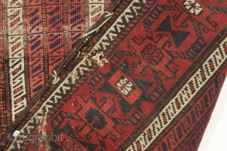 antique baluch rug with an interesting and unusual design. Another piece from a local Boston home. Charming cane design field and an attractive unusual border. All natural colors. In fair condition. Even  ...