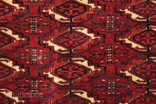 Antique tekke chuval with superb wool and beautiful all natural colors. Crisp drawing with a very elegant skirt panel. A fine weaving with a red ground that almost glows along with clear  ...