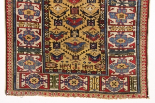antique yellow ground caucasian gendge rug. Nicely drawn large tulip palmettes and an unusually colorful kufic border. Overall good condition with even medium pile. All natural colors including nice greens, light blues,  ...