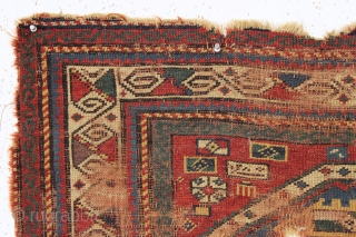 early kazak prayer rug with an unusual mihrab and a very attractive main border. As found, very, very dirty with low pile and scattered damage a shown. Unclear inscribed date. All good  ...