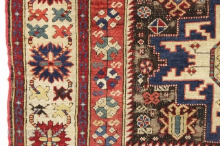 antique caucasian rug, probably kuba, with bold lesghi stars and the complex drawing that indicates good age. As found, mostly good pile elements on a very corroded brown ground. Some scattered damage  ...