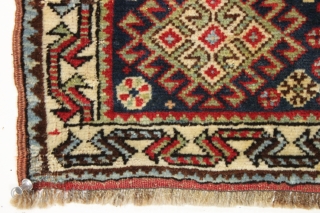 antiique south persian bagface. Classic field design with 12 knots of white cotton in the medallion center. Overall good pile with nice tight weave. Quirky abbreviated top border. Original closure tabs. All  ...