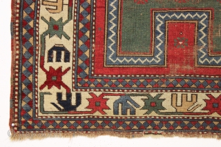 Early kazak prayer rug with true green field. Archaic field elements and bold eye catching ivory border. All good natural colors featuring a beautiful old green, a fine red, multiple blues and  ...