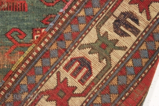 Early kazak prayer rug with true green field. Archaic field elements and bold eye catching ivory border. All good natural colors featuring a beautiful old green, a fine red, multiple blues and  ...