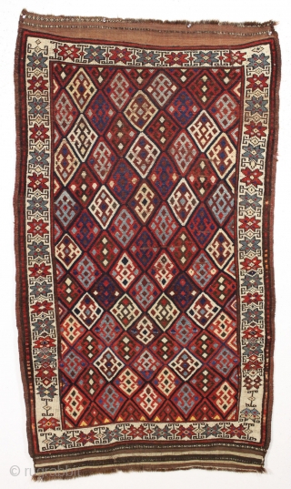 Antique tribal mystery rug. Charming little rug with a kurdish type diamond lattice design, complete with offset knotting in the field area. The overall color palette appears more veramin or luri to  ...