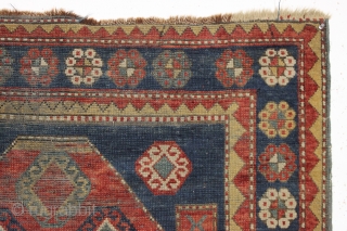 Antique kazak rug. Striking design and colors. "New England condition", in other words, very poor condition with very low pile, heavy wear and as dirty as they come. Who knows what will  ...