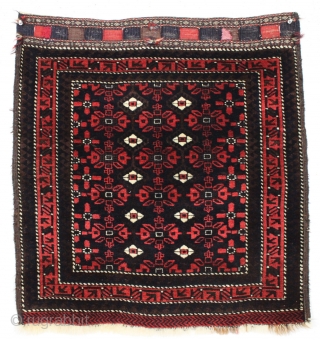 Antique baluch bagface. Perfect condition with full thick pile and tight weave. All rich natural colors and lustrous wool. Small flat weave repair on closure tab as shown. I considered ca. 1800  ...