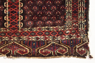 antique yomud ensi with interesting features. Somewhat unusual field array of small flowering plants and a reciprocal elem format with eye catching eagle dveices. All natural colors. Recent thorough wash but "as  ...