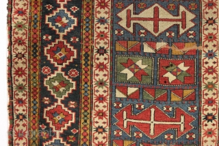 interesting older kazak rug with an unusual design and splendid colors. Eye catching main border. All natural colors featuring beautiful old greens. Appears to have a fair amount of natural dark wool  ...