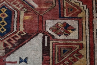 Konya Karapinar Fragment, 170x132 cm. Attached to linen. This damaged and worn 19th c. fragment is remarkable because of the uniqueness of the central emblem, from Turkoman origins.     
