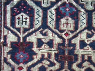 Kuba ( Konagend) 130/112 cm. 19th C.Loss of borders on top and bottom. Small repairs of corroded wool in the border, a tear has been reknotted.But....the beautiful field with its complex design  ...