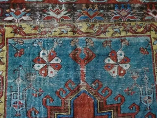 Ladik Prayer rug. Before 1800. 100x200cm, mounted on linen. The great age of this magnificient rug is confirmed, apart from the iconographics, by the colors. The deep stone-red of the 'ocak'( the  ...