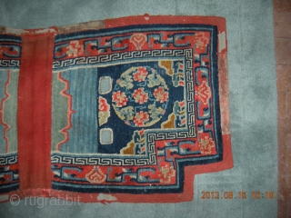Tibetan Lower Saddle Rug; 51”x24” Chinese silk brocade medallion design. Overall condition good with wear on felt border.               
