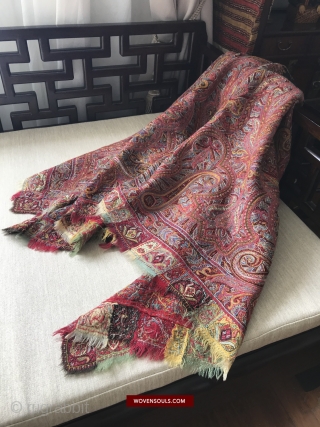 A heavily embroidered Kerman shawl with some applique work. Extremely dense work that has motifs within motifs. See more here: https://wovensouls.com/products/1525-antique-persian-kerman-kirman-resht-rasht-patteh-pateh-doozi-embroidered-wool-shawl            