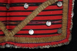 A late 19th century Bulgarian pristilka apron from the Vratsa region with over 160 Ottoman silver alloy coins stitched along the side and bottom edges and front. Very finely woven flat weave  ...