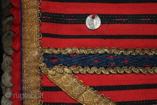 A late 19th century Bulgarian pristilka apron from the Vratsa region with over 160 Ottoman silver alloy coins stitched along the side and bottom edges and front. Very finely woven flat weave  ...