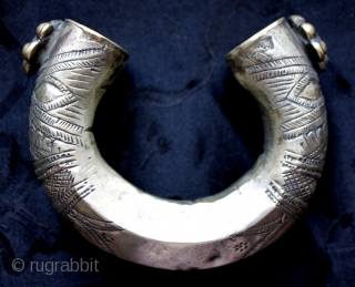 One of a collection of antique silver late 18th to early 20th century silver and silver alloy bracelets. Well executed hand hammered and stamped/chased tribal decoration and added ornamental pieces with glass  ...