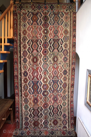 Finely woven 19th east Anatolian kilim with good colours complete with full borders at both ends, some corroded weft, old faded repairs and minor holes; a worthwhile restoration project. Size 386x160cm. Unusual  ...