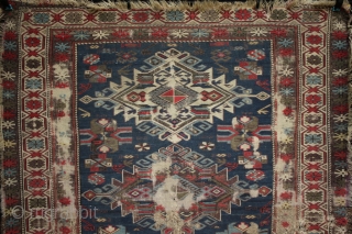 A worn 19th century Shirvan rug with archaic large medallions. Foundation and loss to borders, an interesting example. 140x120cm

For more photos see: http://www.kilim.ie/TRIBAL_RUGS_and_KILIMS/Pages/SMALL_KNOTTED_RUGS.html

Please contact me for more information     